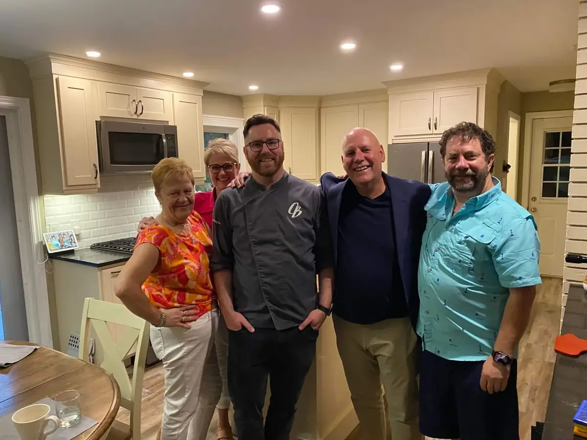 Friends gathered around a beautifully set table sharing an intimate dinner